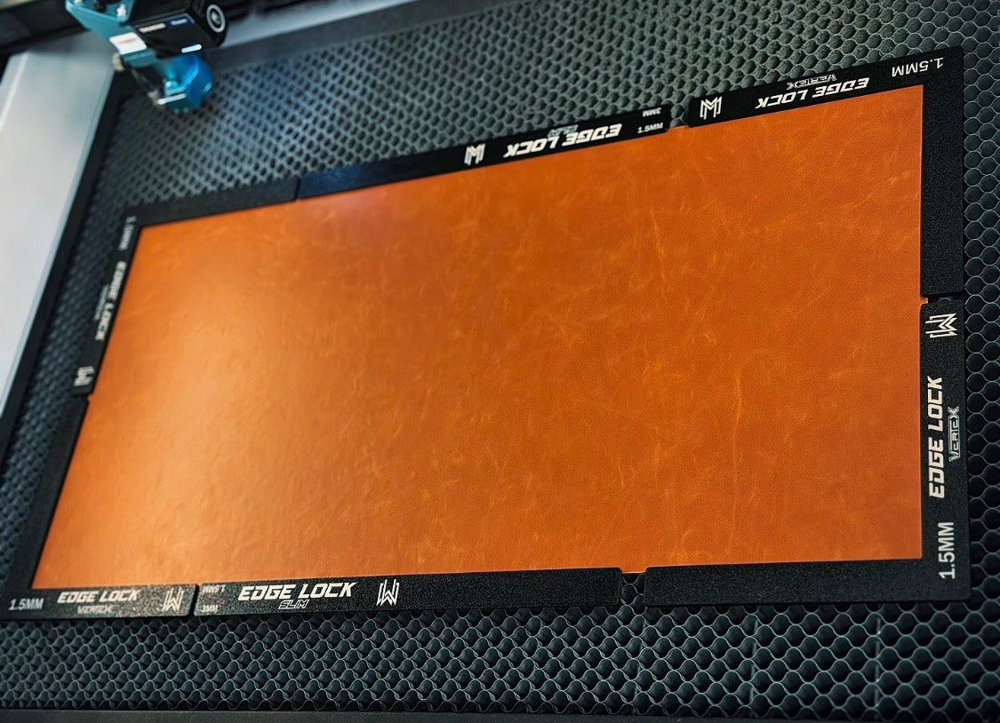 Leatherette sheet with 'Edge Lock' magnets on a laser bed